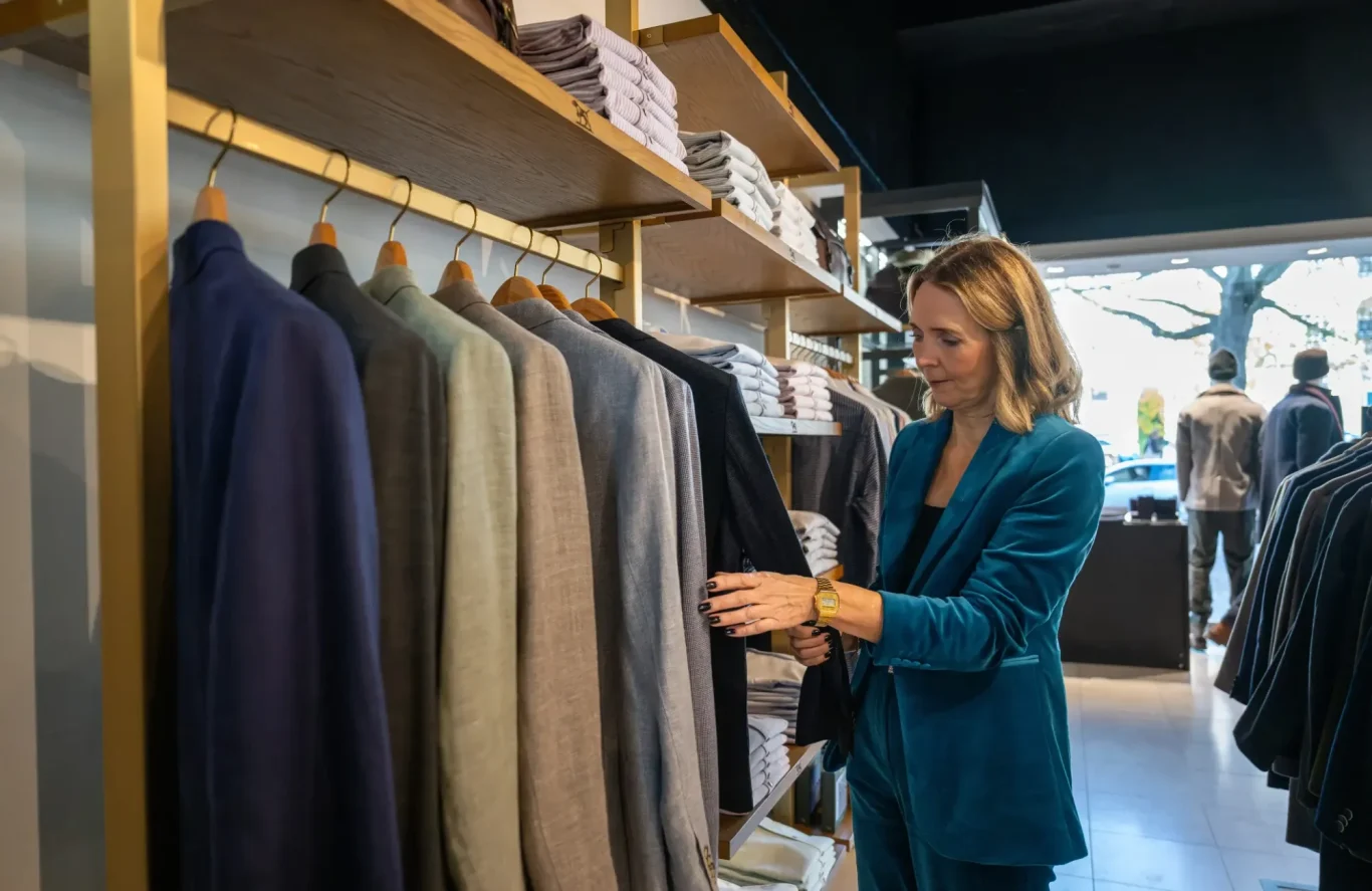 Liz with a male client shopping in a clothes store