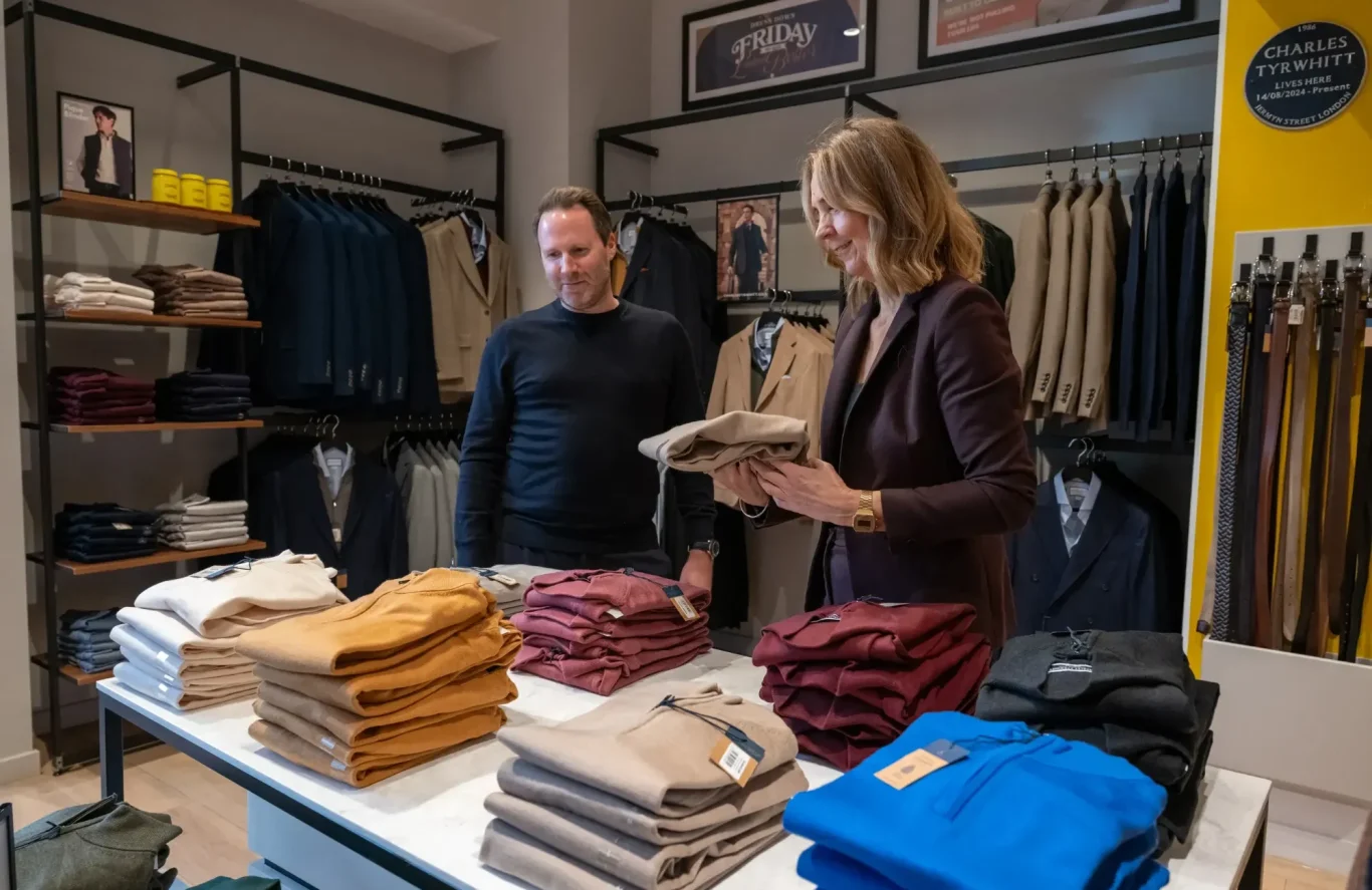 Liz with a male client shopping in a clothes store